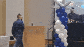 a man stands at a podium that says university of kentucky