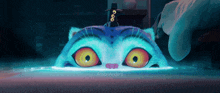 a cartoon cat with a crow on its head is being touched by a person