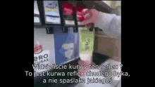 a person is pouring a drink from a vending machine that says coca cola
