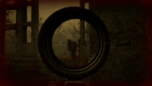 a person is holding a sniper rifle in front of a building