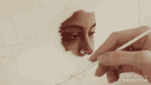 a close up of a person painting a woman 's face with the words made in animotica below