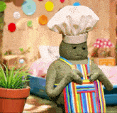 a stuffed turtle wearing a chef hat and apron