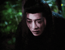 a close up of a man 's face with a rainbow colored butterfly in the corner