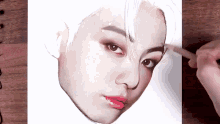 a person is drawing a man 's face with a pencil on a piece of paper .