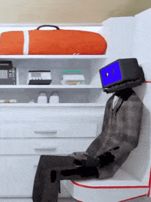 a cartoon character with a blue box on his head