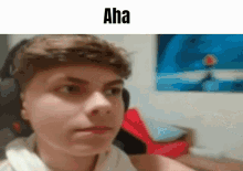 a young man wearing headphones is making a funny face in a blurry photo .