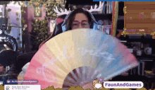 a woman is holding a fan that says " afternoon " on it