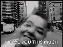 a black and white photo of a person with the words " i love you this much " above them