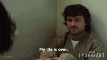 a man sits in a corner with the words " my life is over " on the bottom