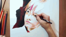 a person is drawing a portrait of a woman with colored pencils