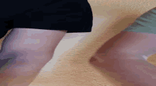 a close up of a person 's arm against a wall