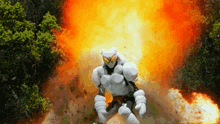a cartoon character is standing in front of a huge explosion