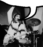 a man is playing a guitar in front of a drum set