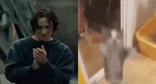 a man in a blue sweater is clapping his hands in front of a yellow box