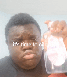 a man holding a bottle of johnson 's baby oil says it 's time to oil up