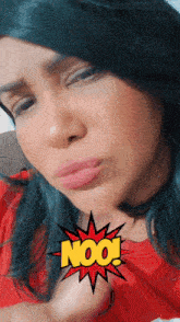 a woman in a red shirt has the word noo written on her face