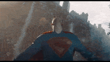 a man in a superman costume flying through the air