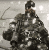 a man in a camouflage uniform holds a gun with a belt that says ' ej ' on it
