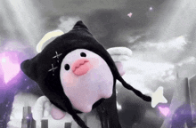 a stuffed animal with wings and a cross on its head