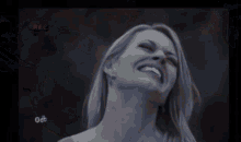 a black and white photo of a woman laughing with the word rec on the bottom right