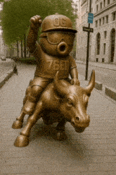 a statue of a boy riding a bull wearing a shirt that says 76ed