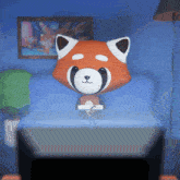 a red panda sitting on a couch with a book in its paws