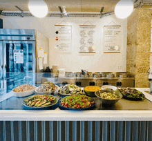 a display of food with a sign that says les legumes les vegetaux