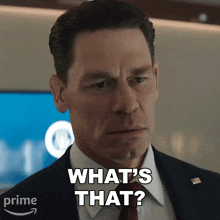 a man in a suit says what 's that