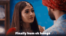a man and a woman are looking at each other with the words finally hum ek honge below them