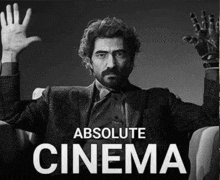 a poster for absolute cinema shows a man with his hands up