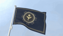 a flag with a bird and a star on it is flying in the wind