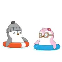 two penguins are playing in the water and one is wearing a hat and goggles
