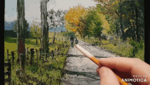 a person is painting a landscape with the words made in animotica visible
