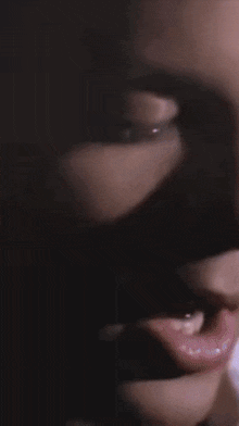 a close up of a person 's face with their mouth open
