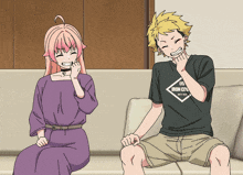 a boy and a girl are sitting on a couch and the boy is wearing an iron crow shirt