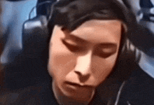 a close up of a person wearing headphones .