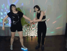 a woman wearing a t-shirt that says young is dancing