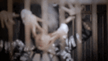 a blurred image of a person in a cage with the word supreme on their shirt