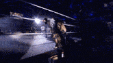 a wrestling ring with a sign that says ' smackdown ' on it in the background