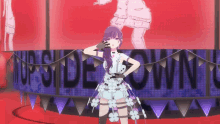 a girl with purple hair is standing in front of a screen that says upside down