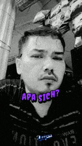a man with a mustache is wearing a shirt that says apa sich