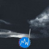a green light shines through a cloudy sky above a blue circle that says mw
