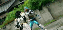 a man in a mask is fighting another man in a superhero costume .