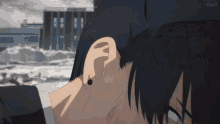 a close up of a person 's ear with a building in the background and the word kiwix on the bottom