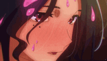 a close up of a woman 's face with pink drops on her face