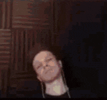 a blurry picture of a man wearing headphones