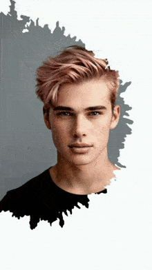 a young man with pink hair and blue eyes looks at the camera