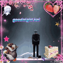 a picture of a man standing next to a cat and a cake that says goodnight