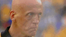 a close up of a man with sweat on his face