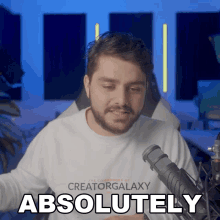 a man wearing a creator galaxy shirt says absolutely